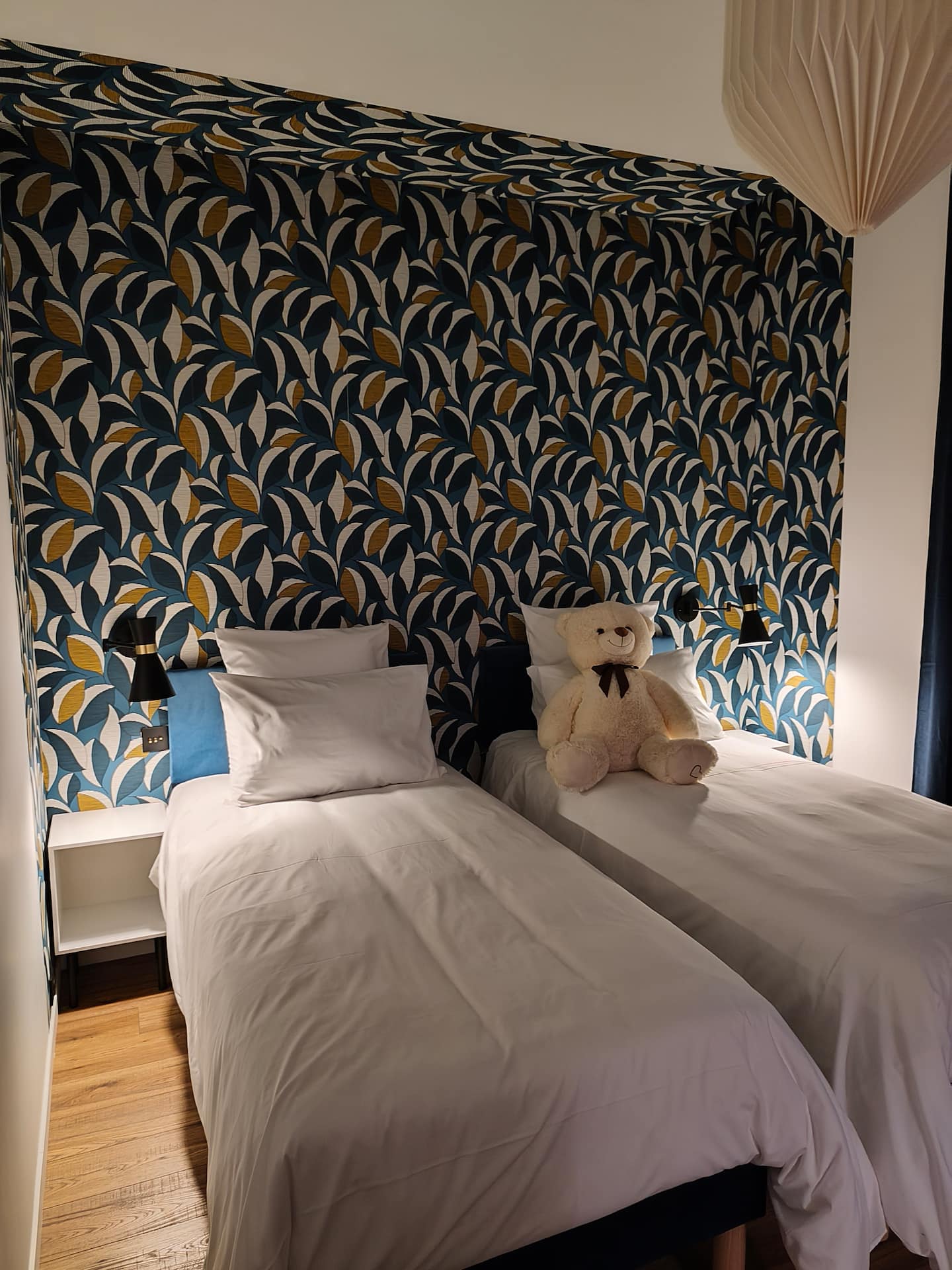 Bleu Horizon room at Le 10, double bed and graphic wall